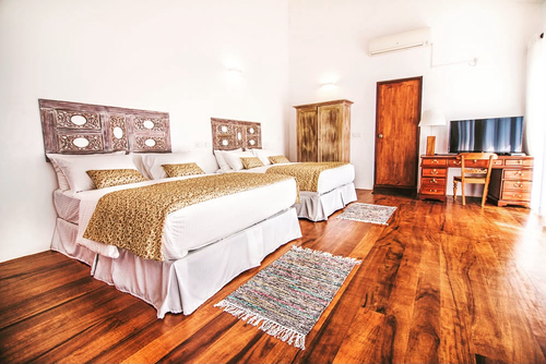 The Superior Family Room at Kandy Casa with its air conditioning unit above the door