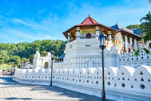 The octagonal tower and white walls of the Temple of the Tooth Relic in Kandy
