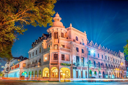The Queen’s Hotel in Kandy city centre, lit up at night