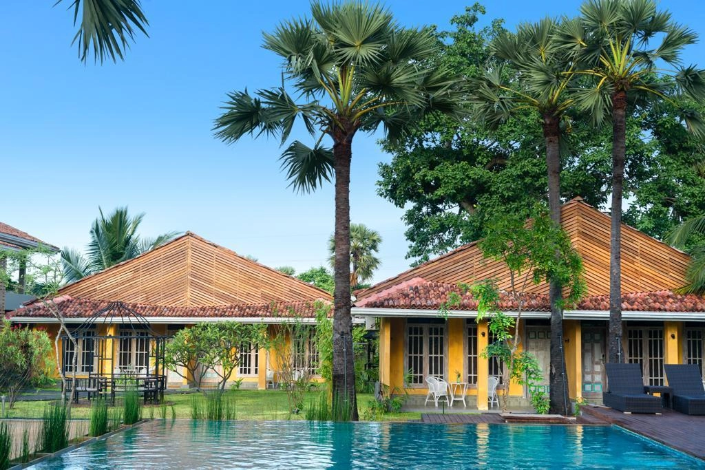 The pool at Palmera Eco Resort in front of the guest rooms