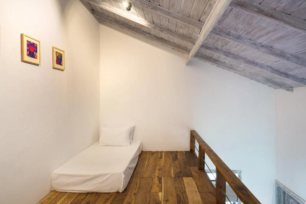 A single mattress in the attic of a Deluxe Family Chalet