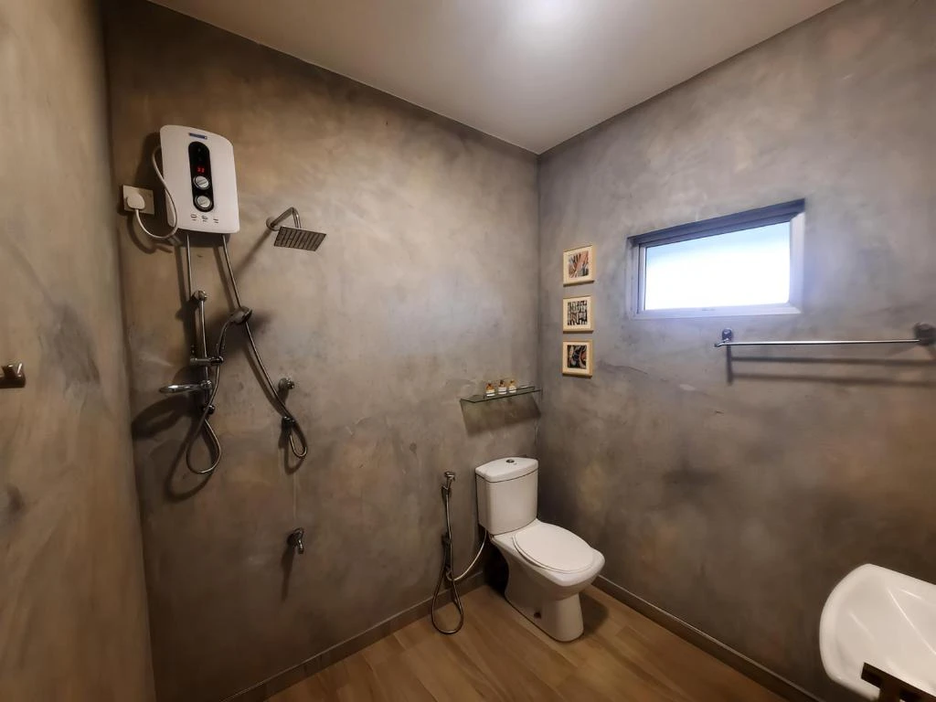 The bathroom of a Standard Twin Room, with its hot water shower