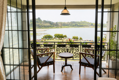 Two chairs on a balcony at Royal Lake looking out over Gregory Lake