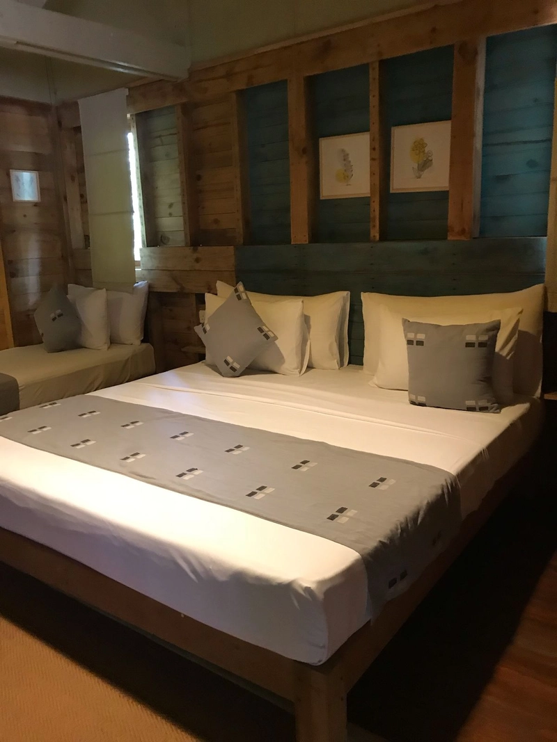 A Triple Room with Pool View made up for arrival